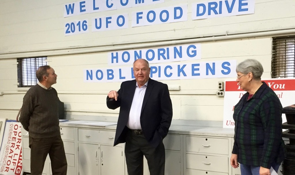 Dunbar Mayor Terry Greenly (center) expresses his support for the work of United Food Operation to UFO's Elaine Harris. With Greenly is Dunbar Councilman Steve Arnott.