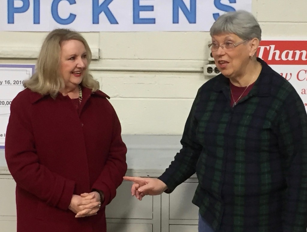 The contributions of Frontier Communication are recognized by UFO's Elaine Harris. On left is XXX ZZZZZZ of Frontier's West Virginia operations.