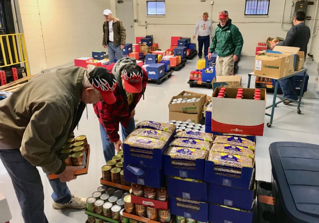 Volunteers from the Nitro Food Pantry load pallets.